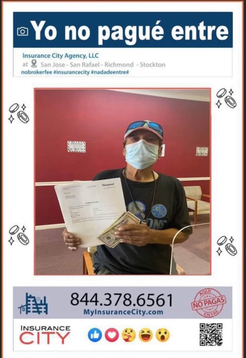 Insurance City auto policyholder holding signed policy and cash savings from not paying a broker fee