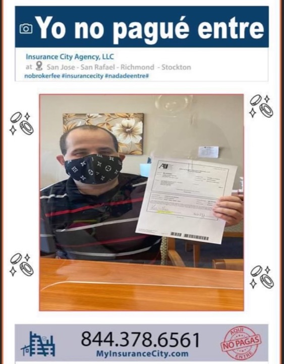 Insurance City customer at Stockton office holding new California auto insurance policy with no broker fee